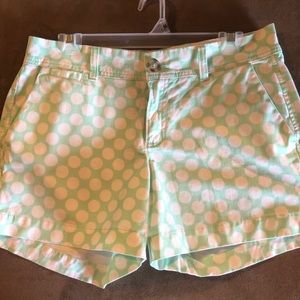 Green and white polka dot shorts
